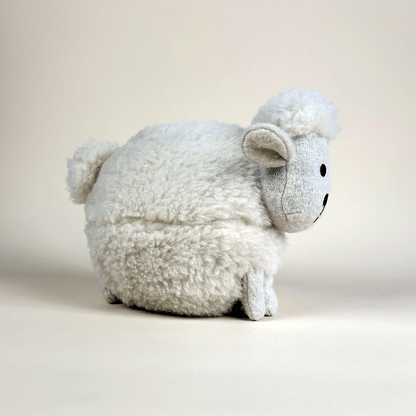 100% wool plush sheep toy on a plain background